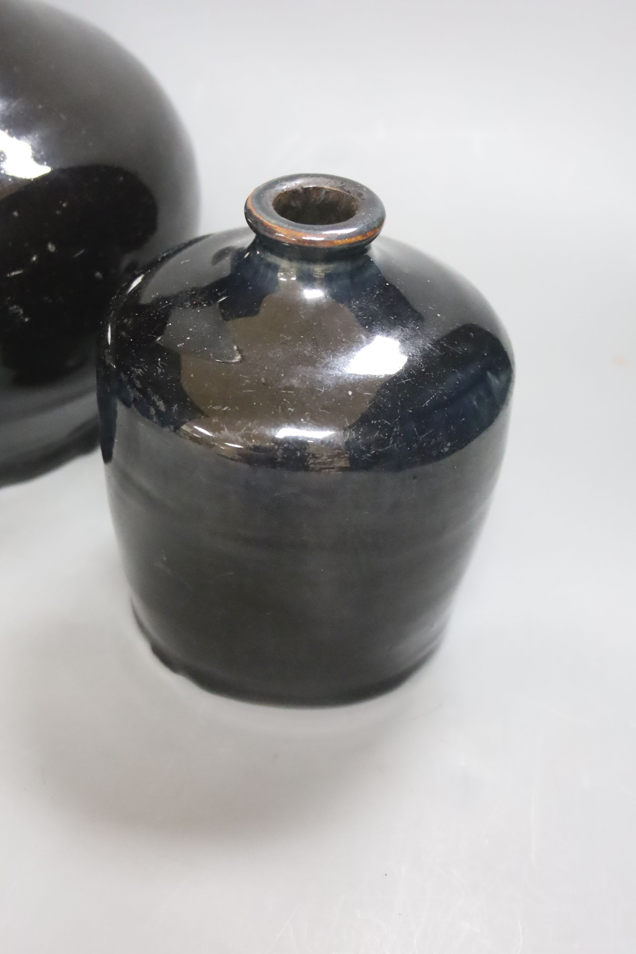 Three Chinese Shanxi black glazed jars, Qing dynasty, height 12 - 20cm